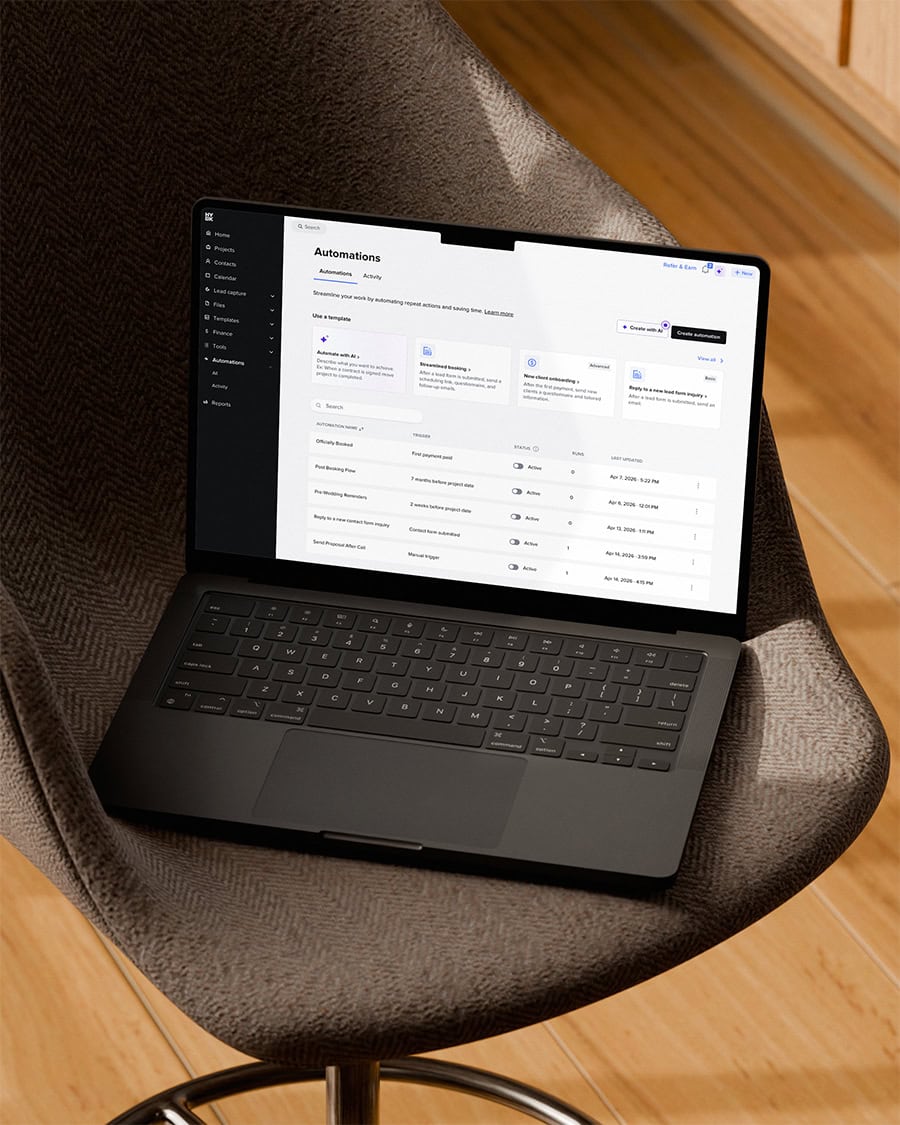 Laptop with automation software on screen, placed on a stylish office chair.