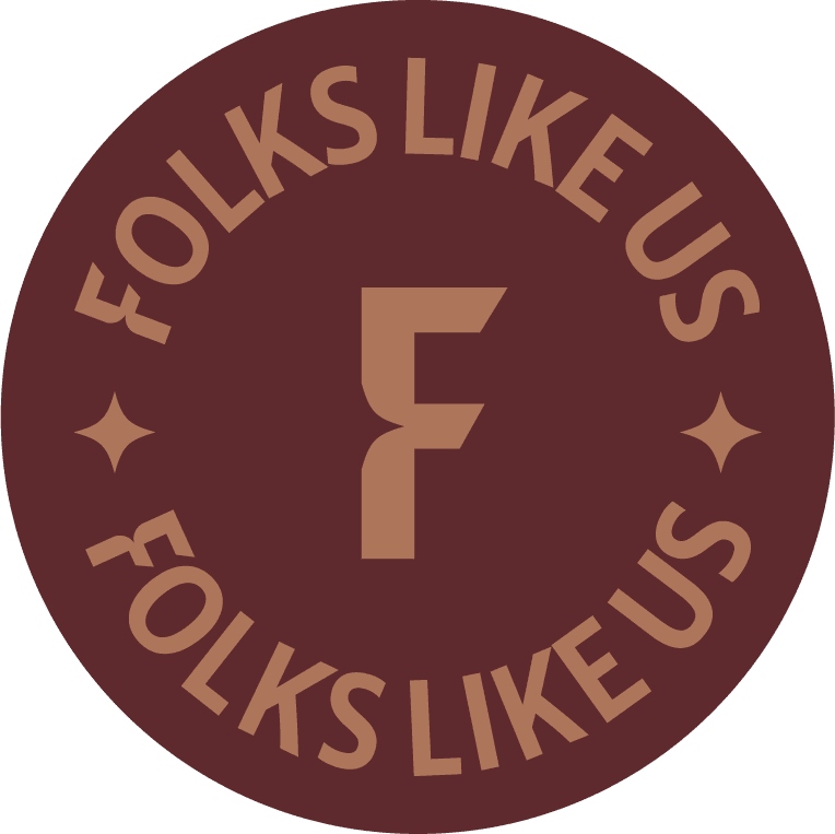 Folks Like Us logo with "F" in the center, circular design, brown tones.
